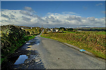H3374 : A muddy puddle along Claragh Road, Carony by Kenneth  Allen