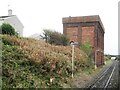 From a Chester-Holyhead train - railway water tower near Holyhead