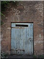 A wooden door on Sand Street