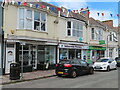 Tattoo studio, pharmacy, charity shop in Reddenhill Road, Babbacombe