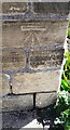 Benchmark on wall junction on east side of Apperley Lane