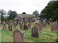 Tinwald Parish Church and part of its burial ground