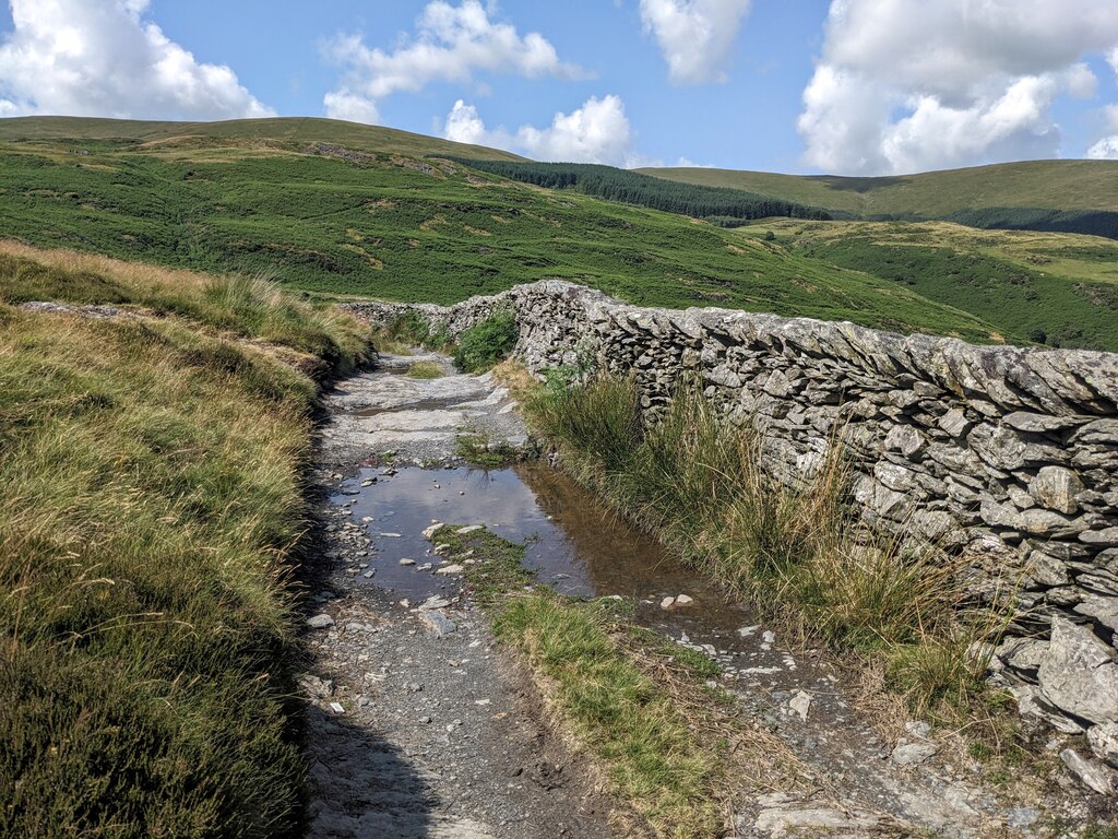 Standing water on the byway © David Medcalf :: Geograph Britain and Ireland