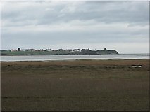 NU1043 : Lindisfarne viewed across the mudflats by Dysdera