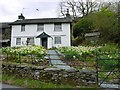 NY3404 : Cottage under Loughrigg Fell by Jo Wood