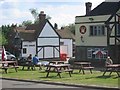 Two pubs opposite the common and the village sign Ley Hill