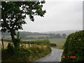 SH9675 : Lane and farmland by Dot Potter