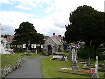 SH8380 : Churchyard at Llandrillo yn Rhos by Dot Potter