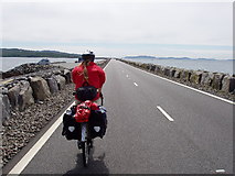 NF7812 : Cycle touring over the Eriskay - South Uist causeway by Calum McRoberts
