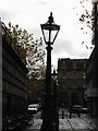 Cast iron lamp posts on Preston flag market