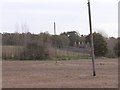 A Field With Hops Farm in the Distance