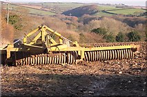 SW7845 : Agricultural Implement and Valley near Langarth by Tony Atkin