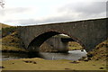 NO3765 : Looking under the old bridge to the new bridge, crossing the South Esk. by Gwen and James Anderson