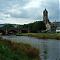 Parish church and wishing well viewed from the banks of the River Tweed