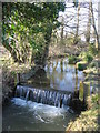 ST7927 : Weir on a tributary of the River Stour by Phil Williams
