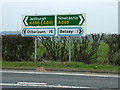 Road signs at the B6309, A696 junction