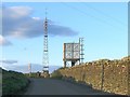 Mast and water tower in hills above Trebanos