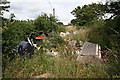 Fly Tipping Behind the Hedge