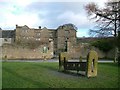 Eyam Hall and the village stocks