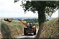 Shobrooke: trimming a roadside hedgebank