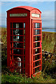 Red telephone box on Gorseness Road, Rendall