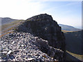 NN2472 : Crags on Stob Coire an Laoigh by Andrew Smith