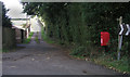 Fingerpost and pillar box on footpath 1465