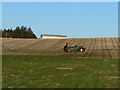 Tractor spreading on stubble