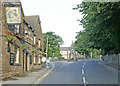 SK3578 : A view in old Dronfield village showing the Blue Stoops public house and the Peel Monument in the distance. by Tony Godwin