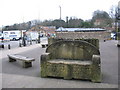 Carved stone seat adjacent to Frome library