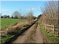 Gated road to Steane Grounds Farm