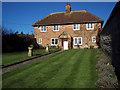 Tennis court lawn at a house in Heytesbury