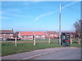 Phone box and village housing, Burwash