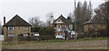 Houses by field in Barton