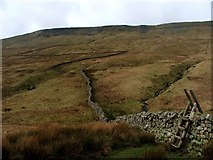SD7379 : Drystone Wall and Stile beneath Combe Scar. by Steve Partridge