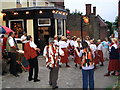 TQ7570 : Tudor Rose pub with Morris Dancers by Clive Stanley