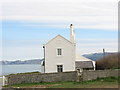 The gable end of one of the pair of houses built for lighthouse keepers at Penmon