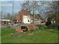 Over the stream to The Black Horse pub