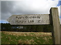 Bridleway to Hungry Law (501m) sign by the A68 road