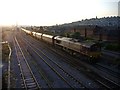 An EWS freight train trundles eastwards, from Newport