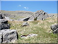 SH6762 : Large boulders in Cwm Bodesi with Creigiau Malwod in the background by Eric Jones