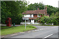 House, telephone  box and road junction at Three Cups Corner