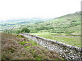 Moel Rhiwen park wall with the village of Rhiwlas in the background