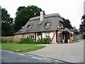 A pretty thatched cottage on Thornden Wood Road