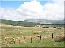 SH7639 : Cors-y-barcud and the Nant-lladron Forest with Arenig Fawr in the background by Eric Jones
