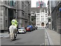 City of London: mounted policeman approaches the Guildhall