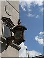 TQ3280 : City of London: plane passes St. James Garlickhythe clock by Chris Downer