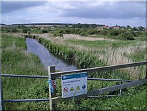 TF8343 : The Burn Outfall Sluice Looking Southwest by Nigel Stickells
