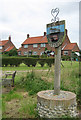 Wickmere/Wolterton Village Sign with "council houses"