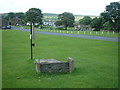 Ancient stocks on village green in Bainbridge